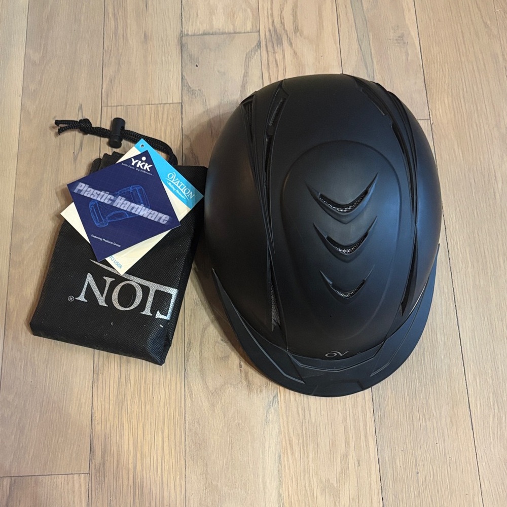 Black ovation brand riding helmet